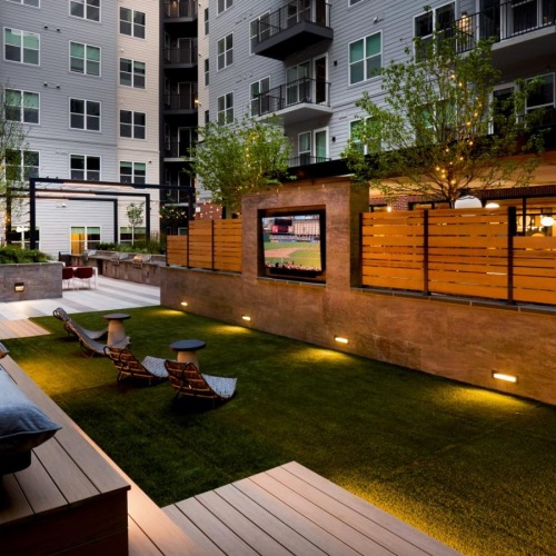 Enjoy open-air lounging, fire pit gathering spaces, and peaceful evening light.