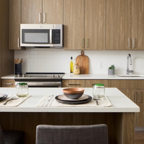 a kitchen with a table and chairs