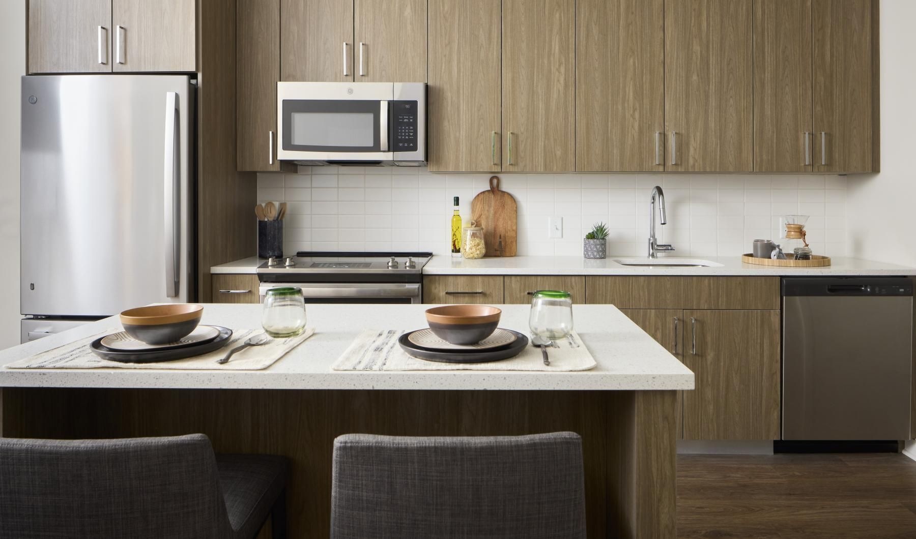 a kitchen with a table and chairs
